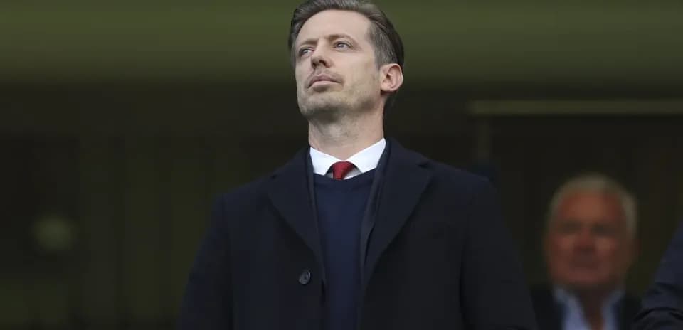 Executive observing the match from the stands