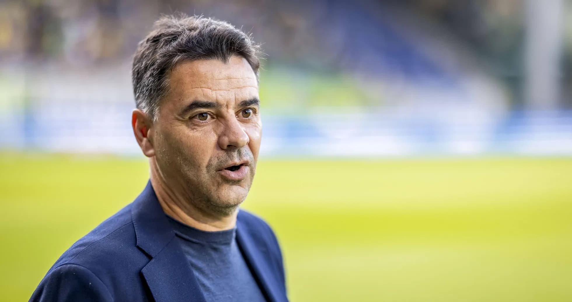 Coach speaking during pre-match event
