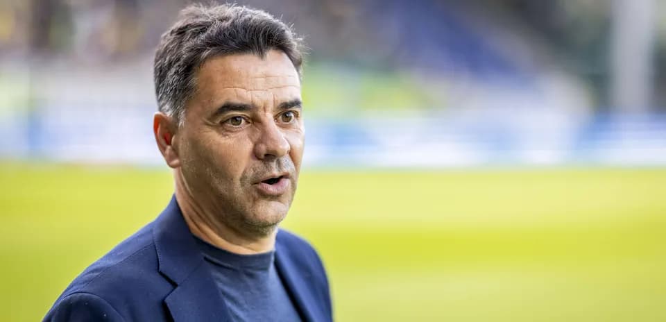 Coach speaking during pre-match event