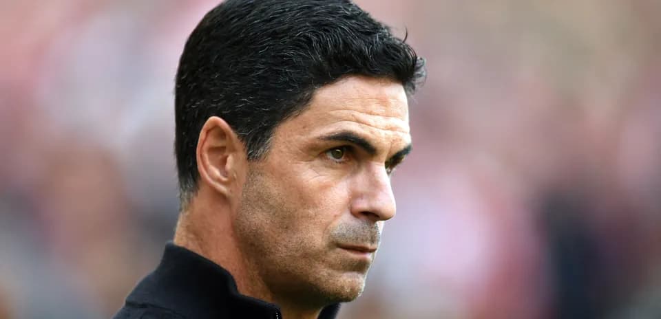 Manager observing from the sidelines during match