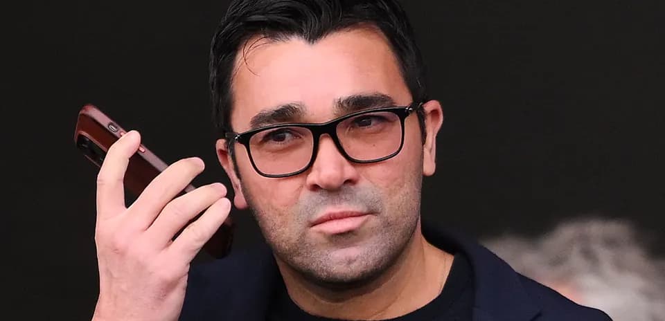 Man holding a phone while looking intently