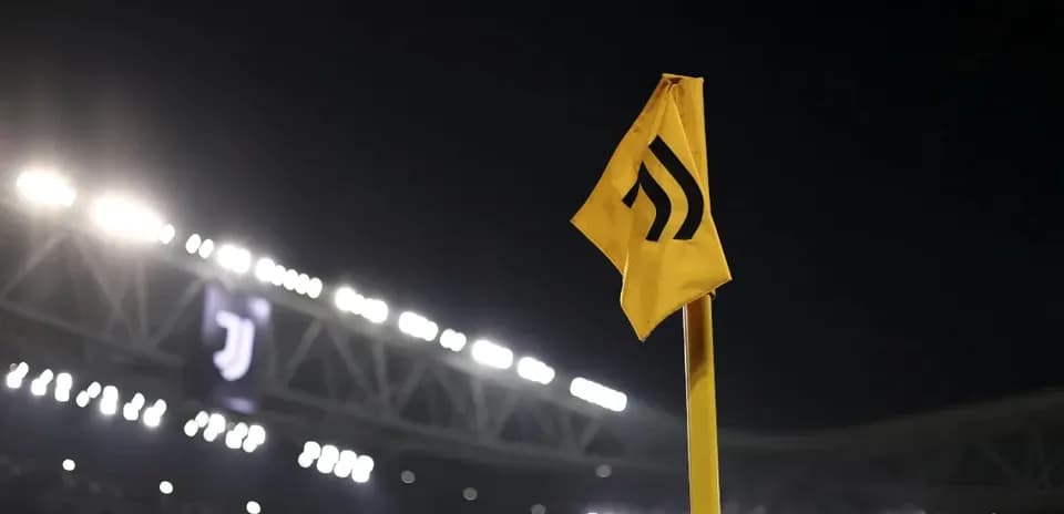 Yellow corner flag with Juventus logo in background