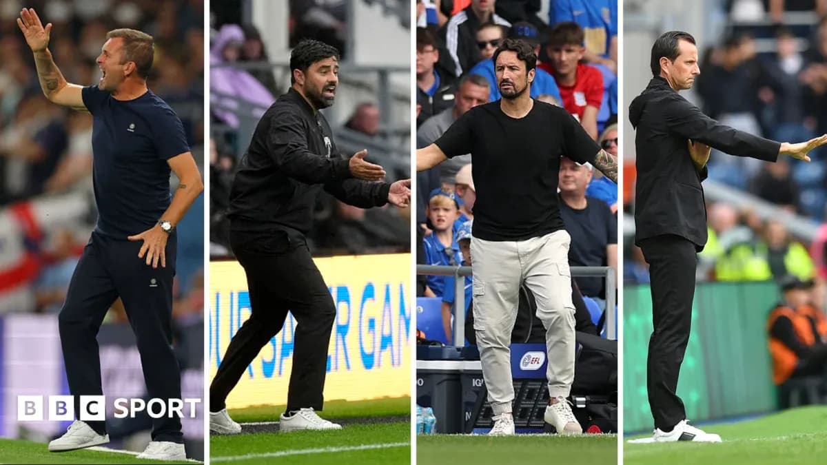 Four football managers giving instructions on the sideline