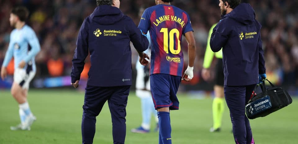 Player Lamine Yamal receiving medical attention on field