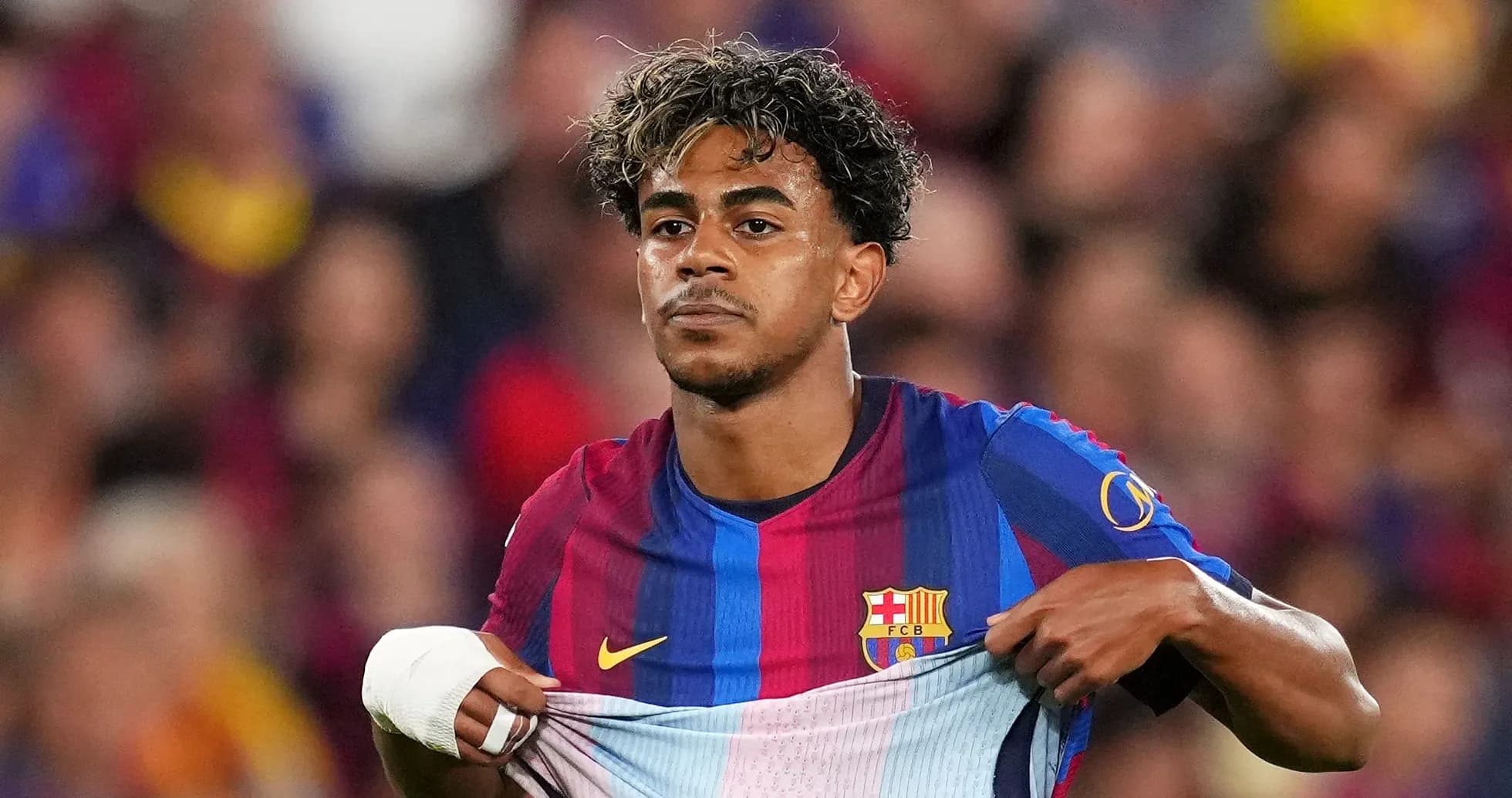 Player revealing Barcelona jersey during match