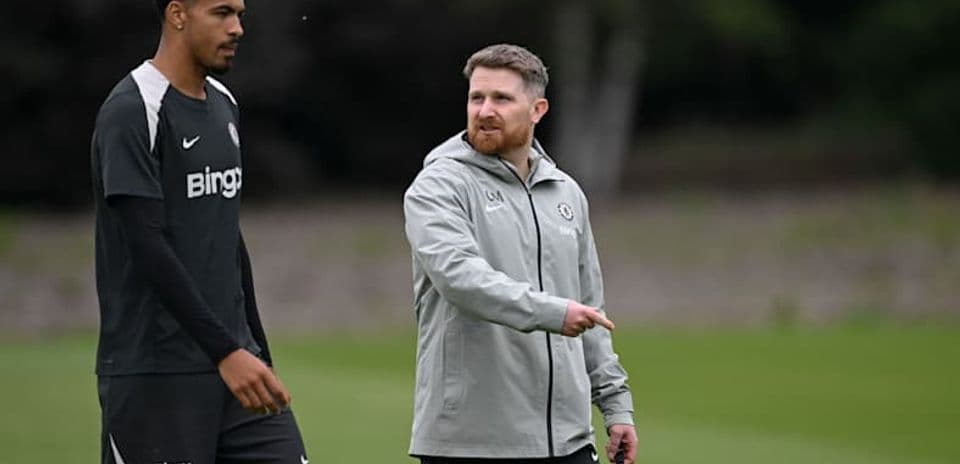 Player and coach discussing during training session