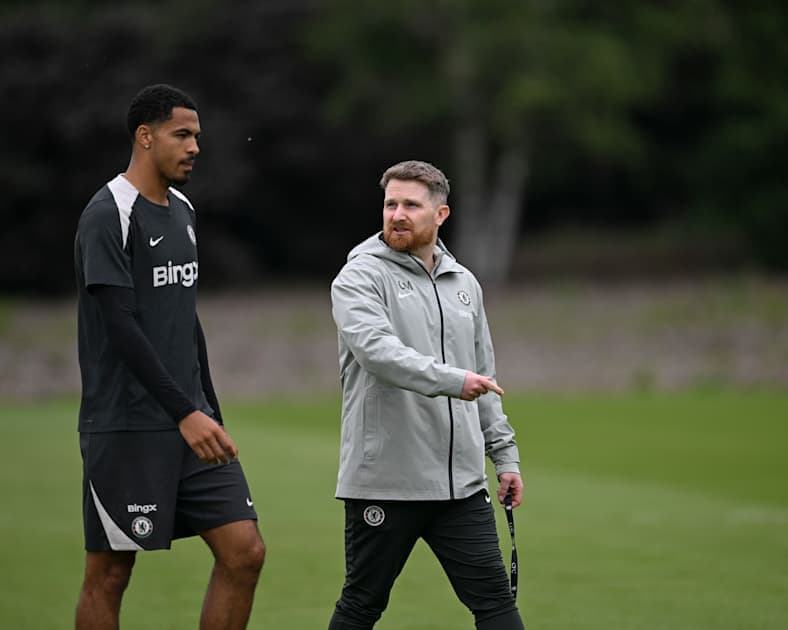 Player and coach discussing during training session