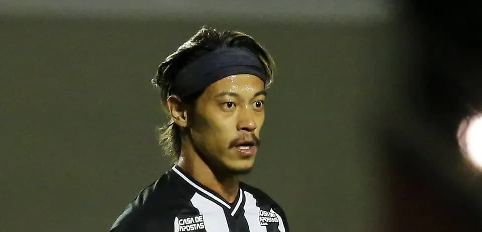 Player wearing black and white jersey during match