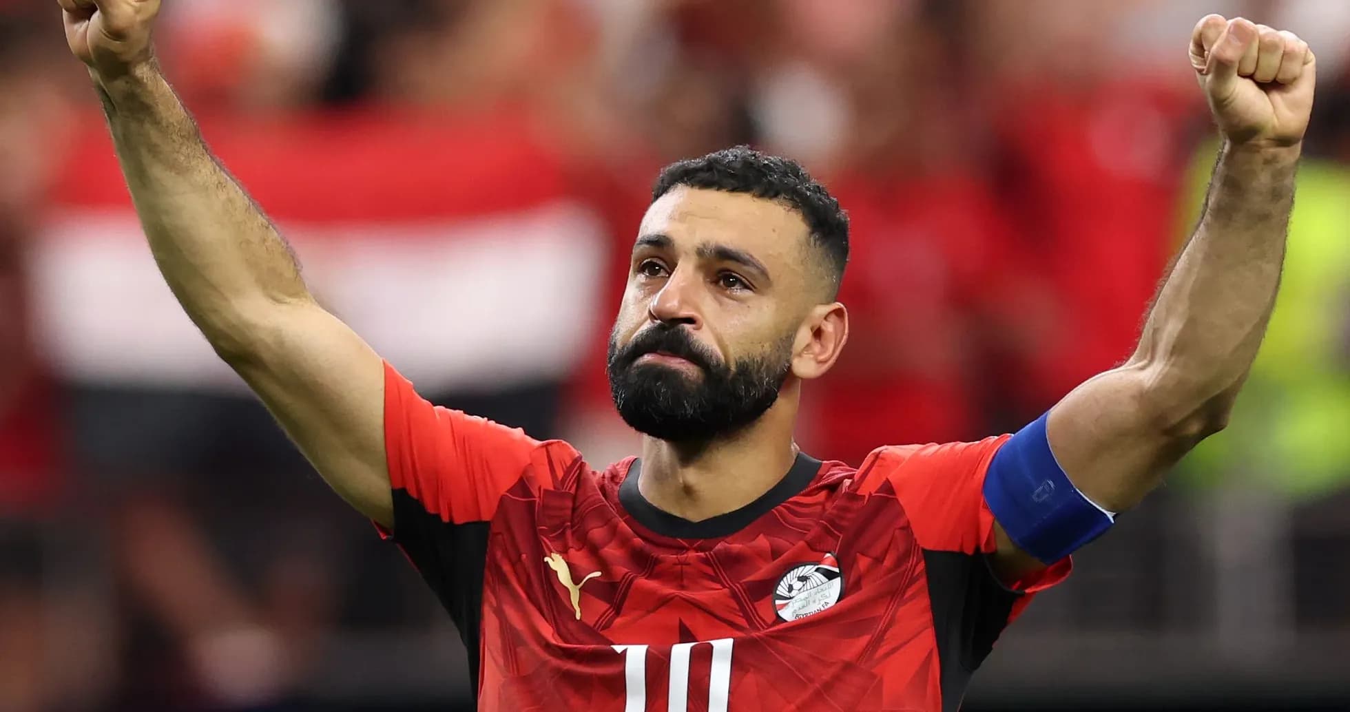 Player celebrating with raised fist in football jersey