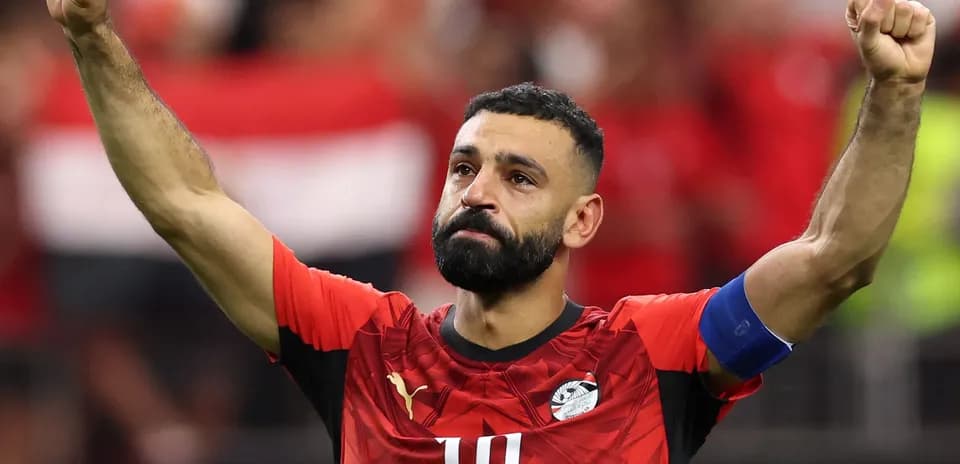 Player celebrating with raised fist in football jersey