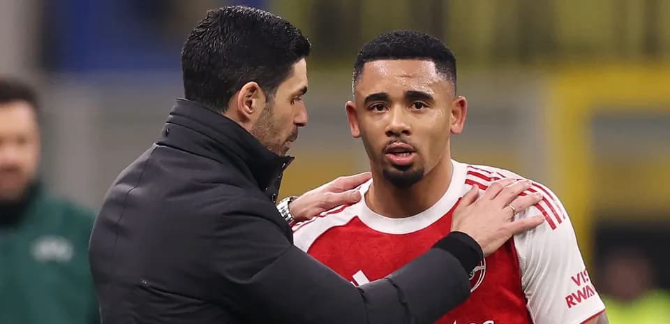 Coach talking to player during match substitution