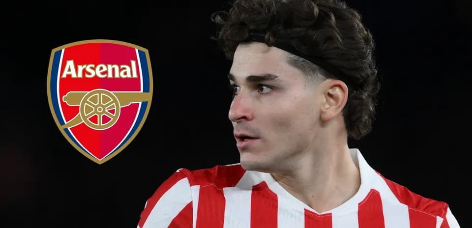 Player in red and white kit near Arsenal logo