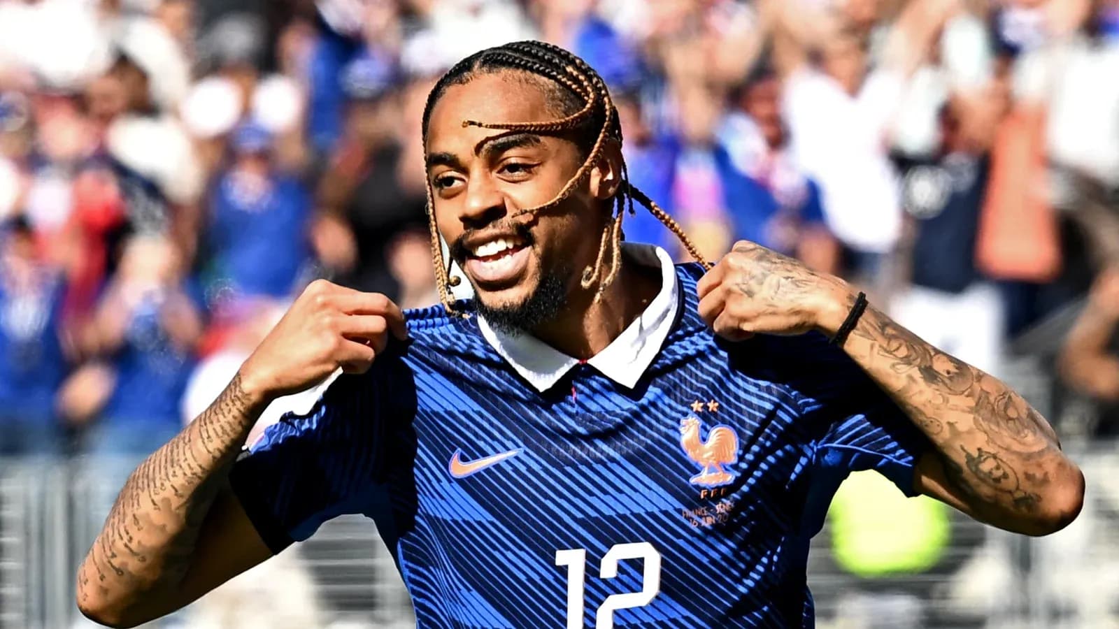 Player celebrating and showing jersey after scoring
