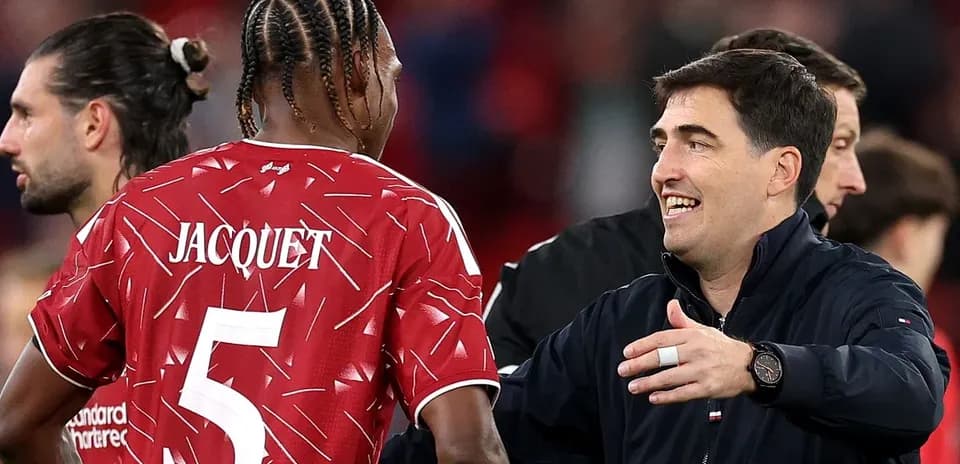 Player Jacquet and coach interacting after match