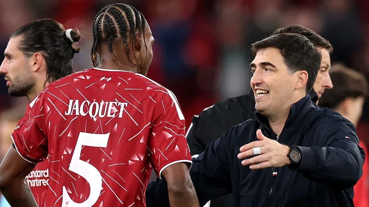 Player Jacquet and coach interacting after match