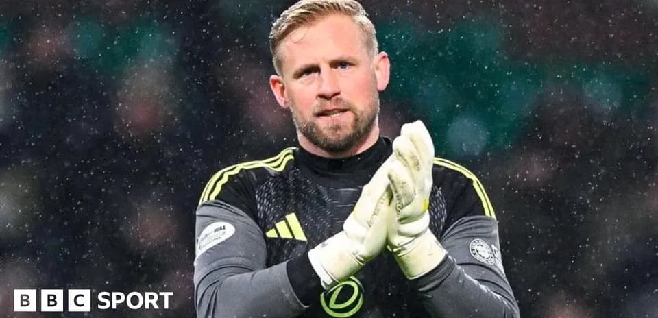 Goalkeeper clapping during snowy match conditions