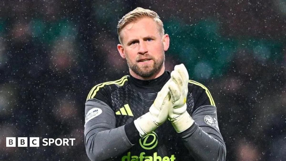 Goalkeeper clapping during snowy match conditions