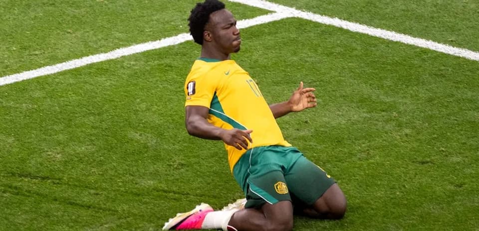 Player celebrating on the field after scoring