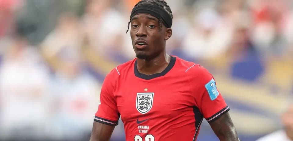 Player in red England jersey during match