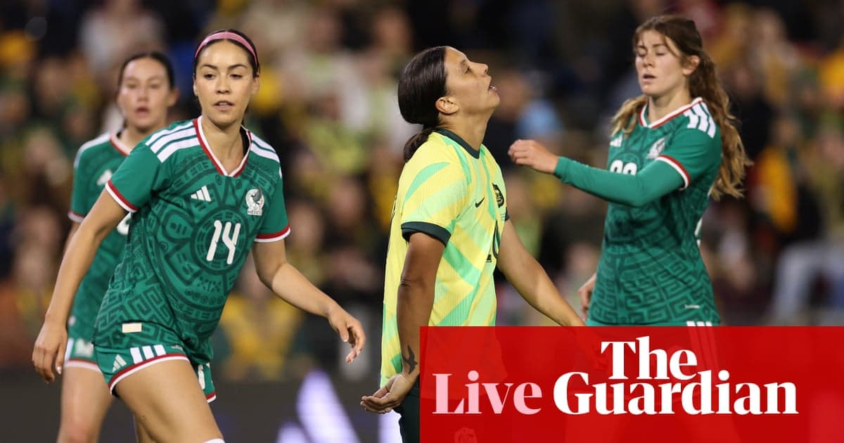 Players from Mexico and Australia during match action
