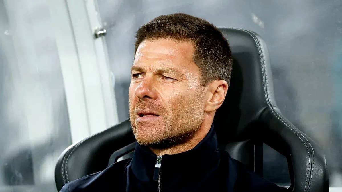 Coach sitting on bench during match