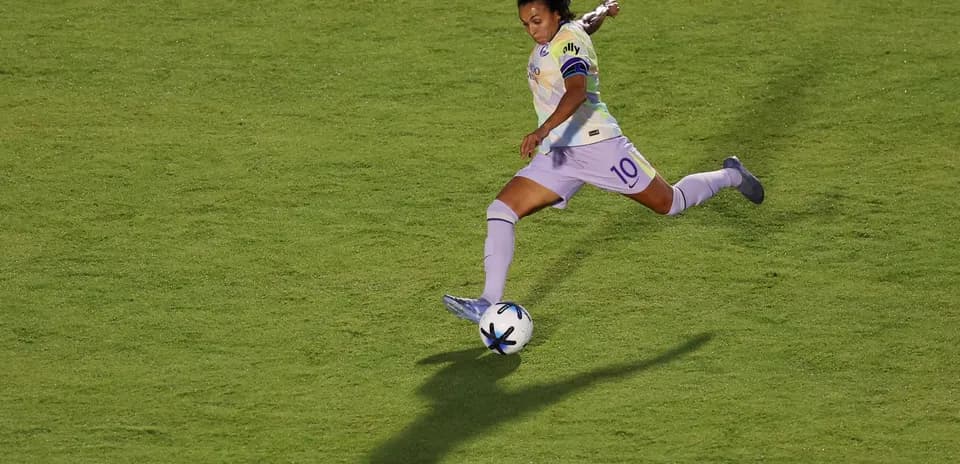 Player kicking ball during NWSL match