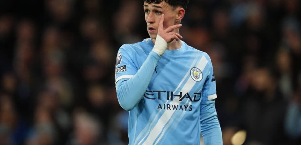 Player gesturing during match in light blue jersey