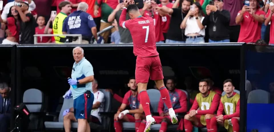 Cristiano Ronaldo celebrating with fans during match