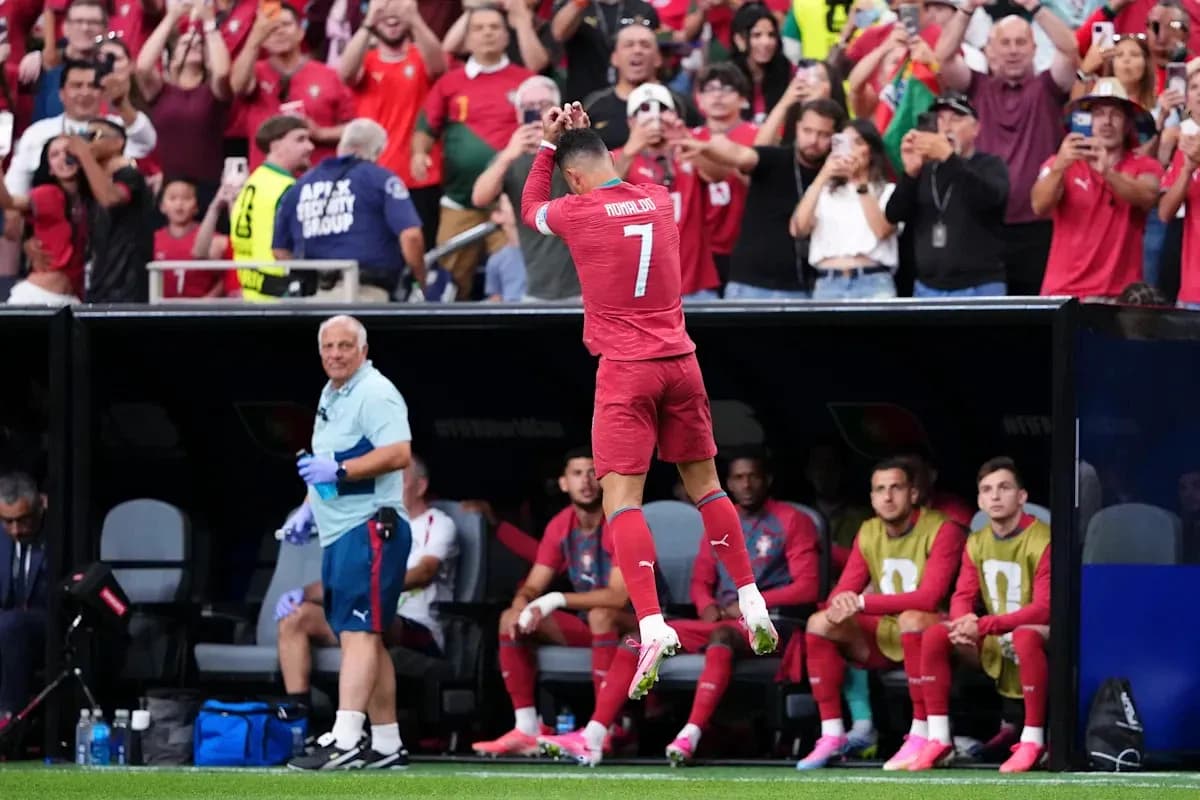 Cristiano Ronaldo celebrating with fans during match