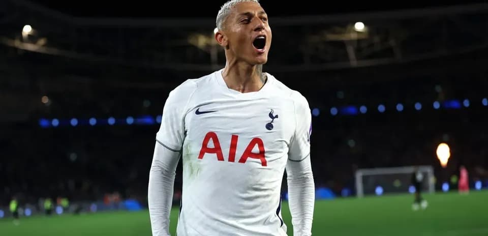 Player celebrating a goal in Tottenham kit