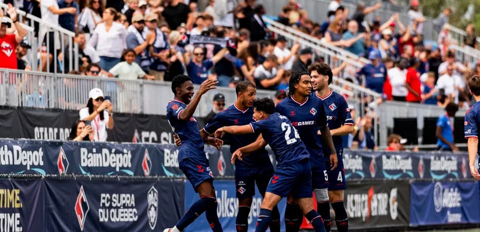 Players celebrating a goal during match