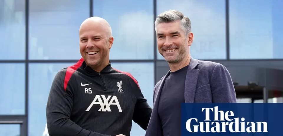 Two men shaking hands outside Liverpool training facility