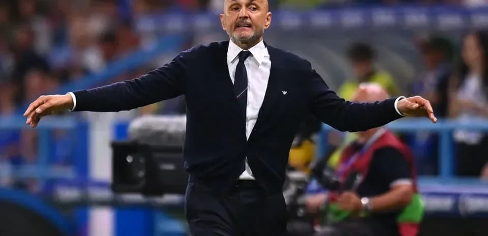 Coach gesturing during a match on the sidelines