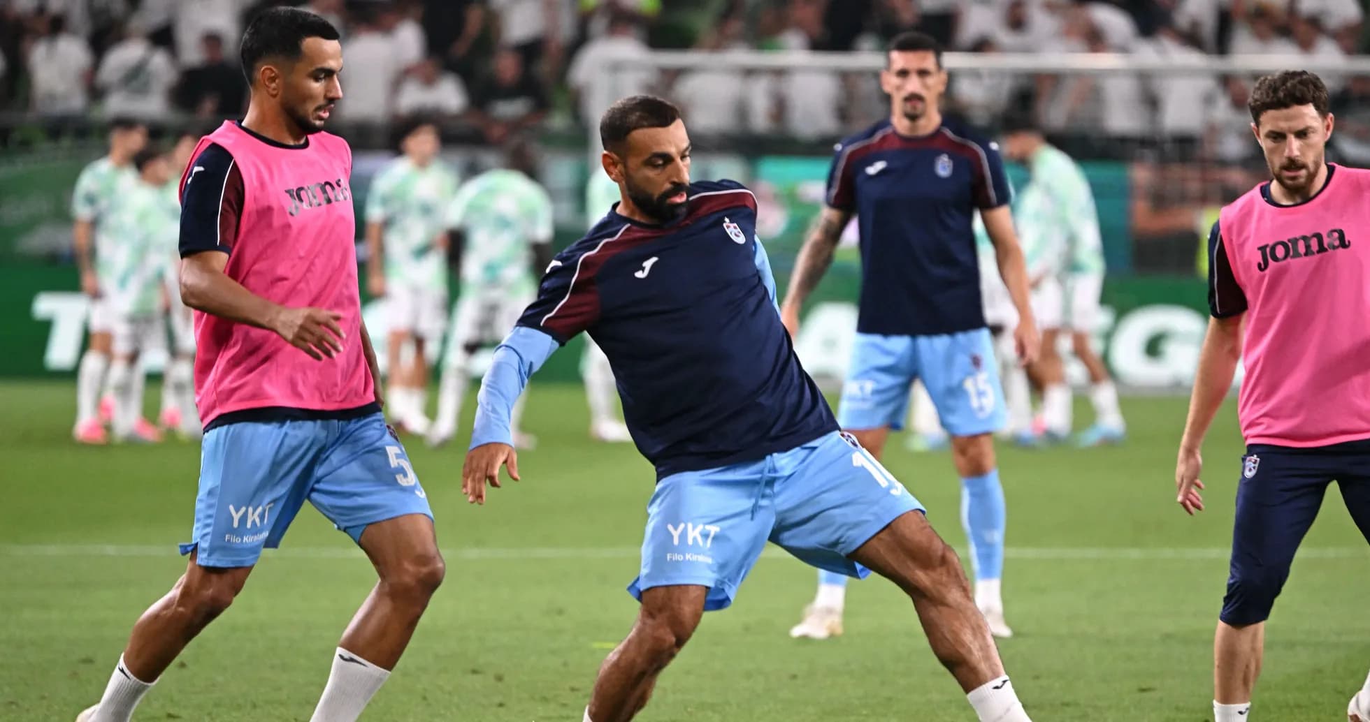 Players warming up on field before match