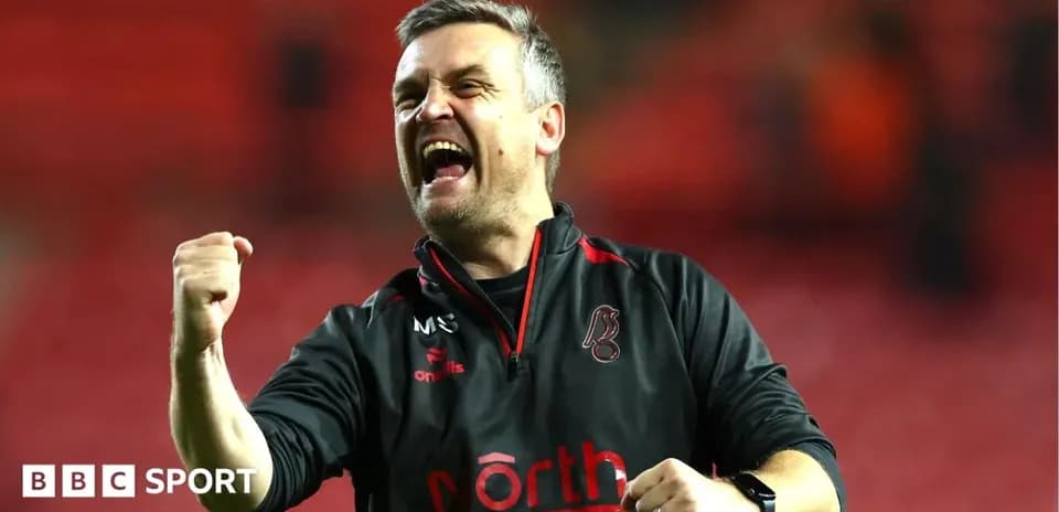 Coach celebrating enthusiastically after a victory