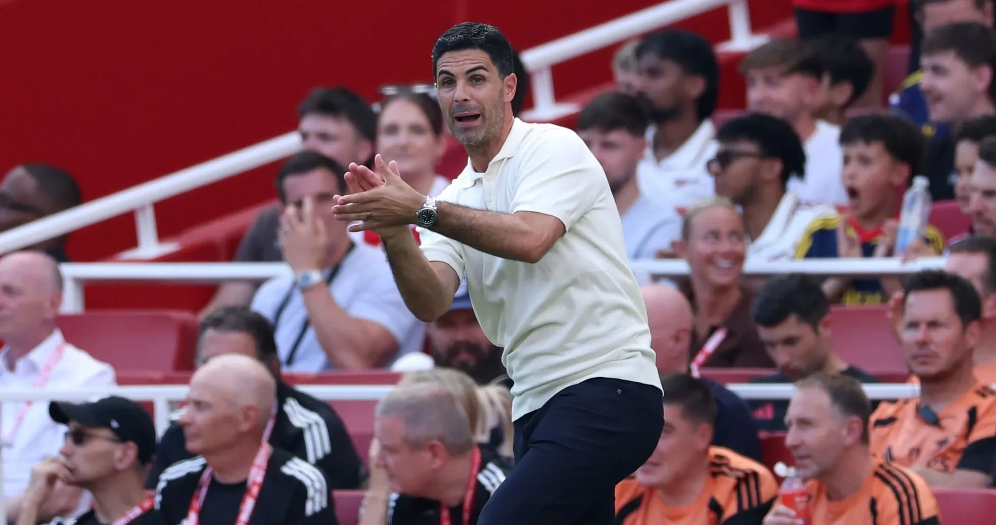 Manager directing players from the sidelines during match