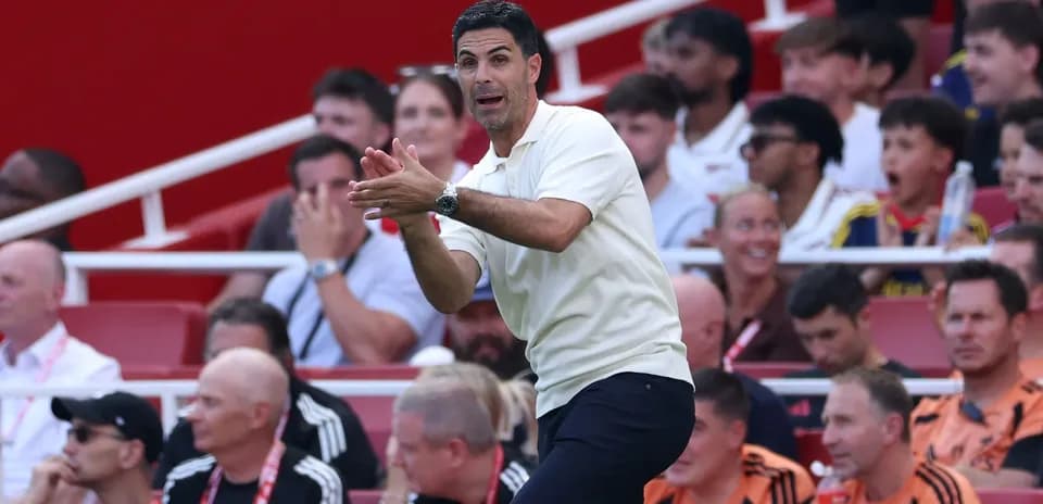 Manager directing players from the sidelines during match