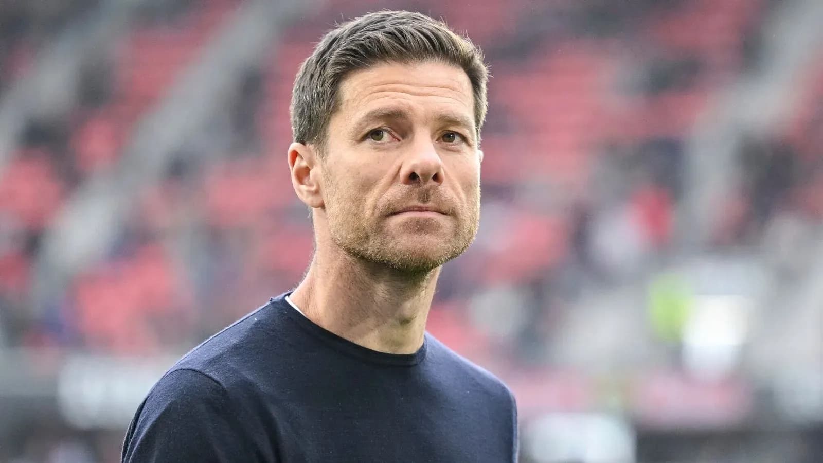 Coach looking on from the sidelines during match