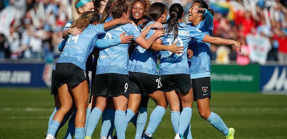 Chicago Red Stars celebrating after scoring a goal
