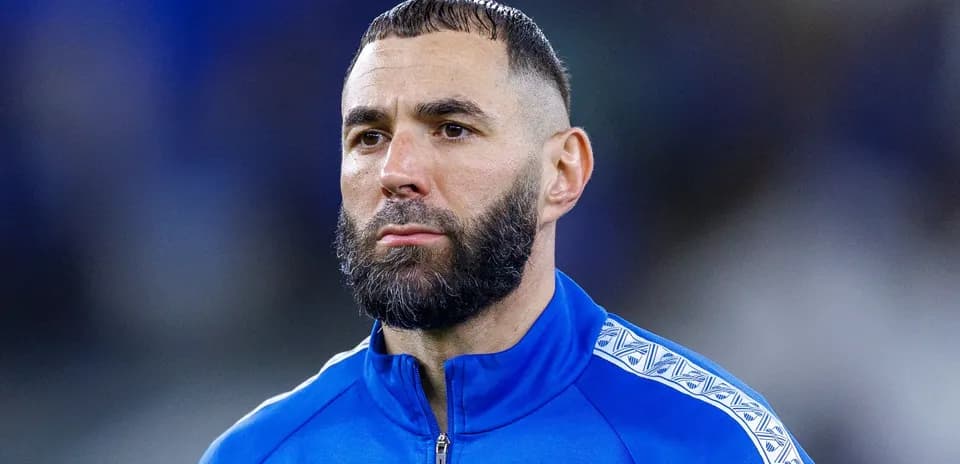 Player in blue training jacket on the field