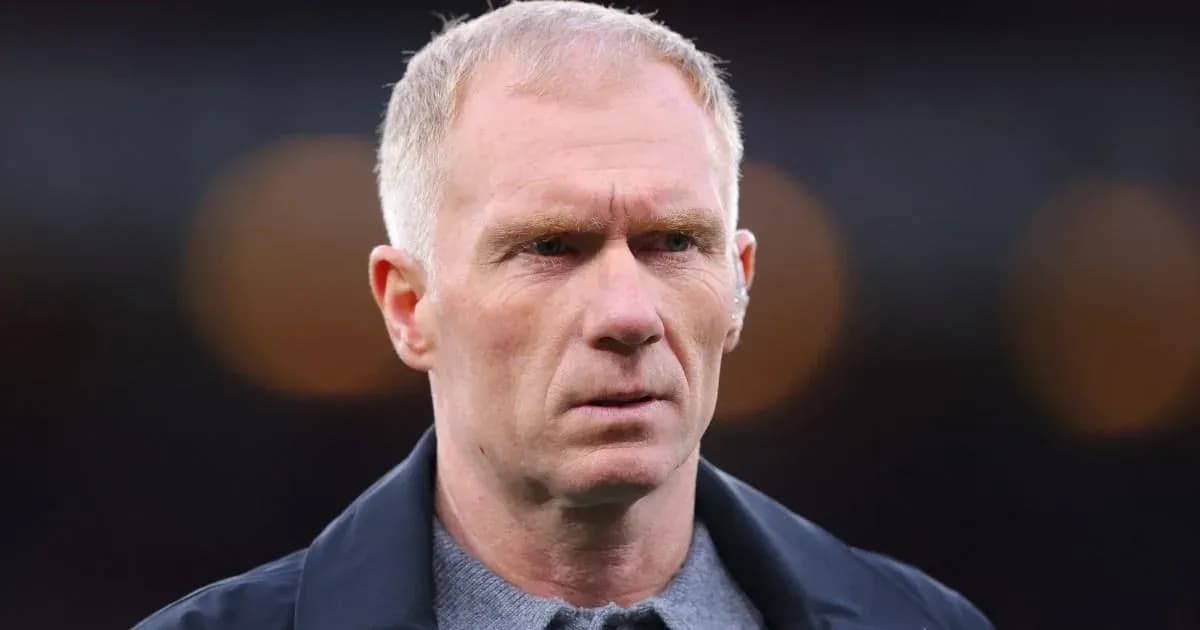 Man in a dark jacket looking intently