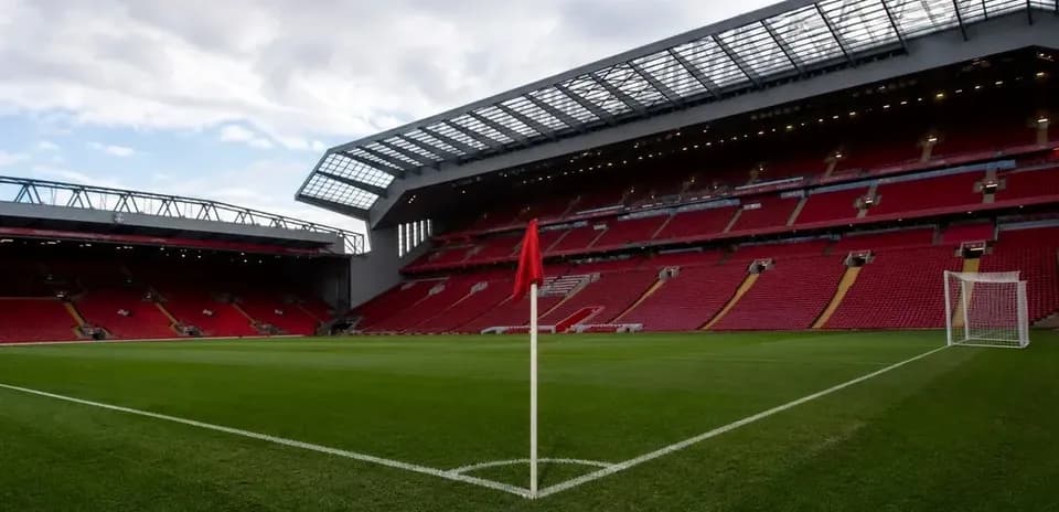 Empty football stadium with corner flag and goal