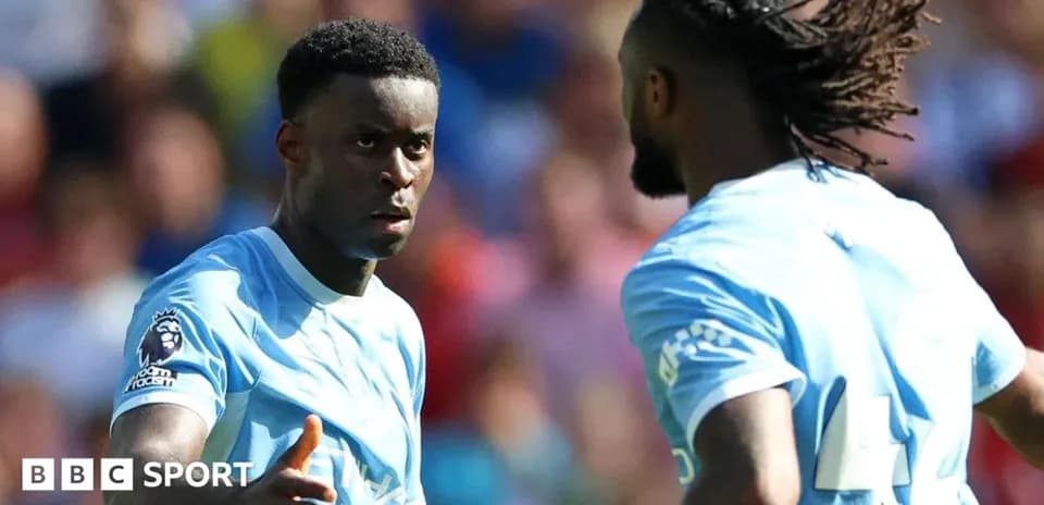 Two football players discussing during a match