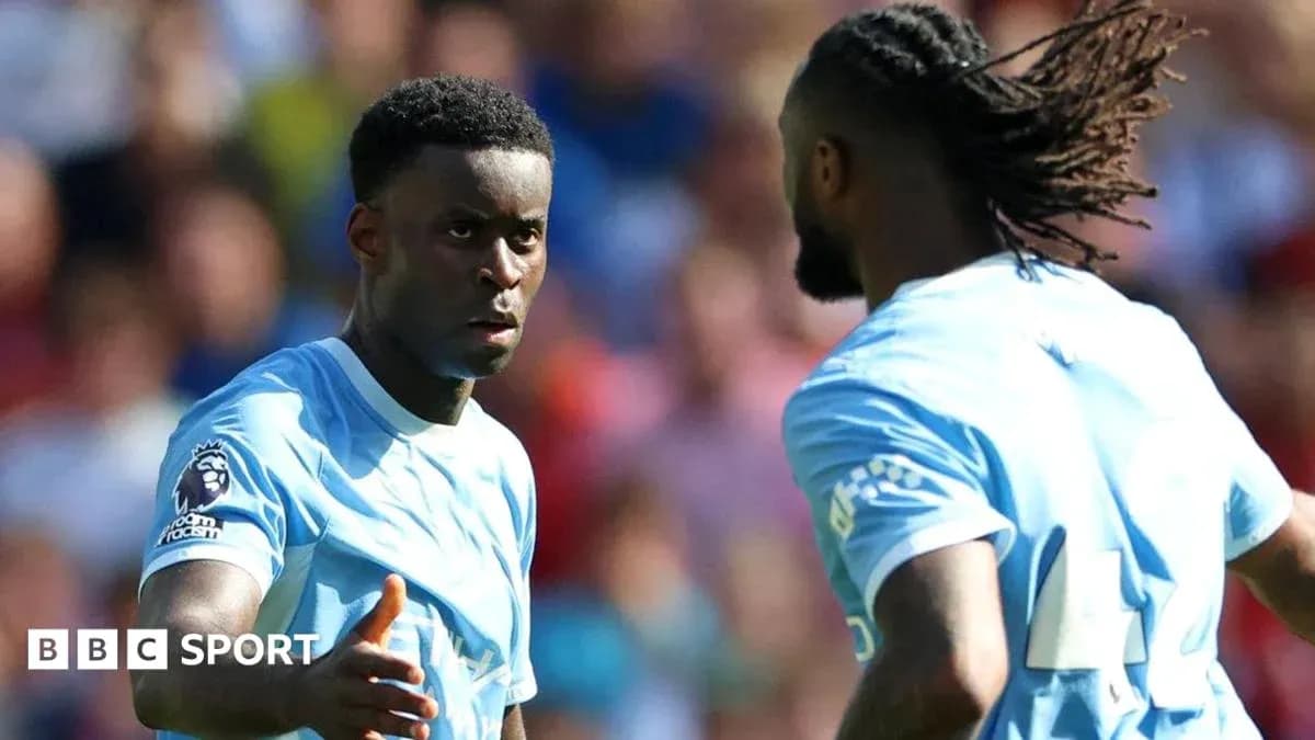 Two football players discussing during a match