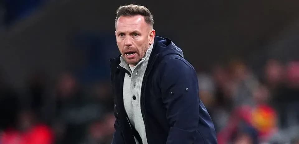 Manager coaching from the sidelines during match