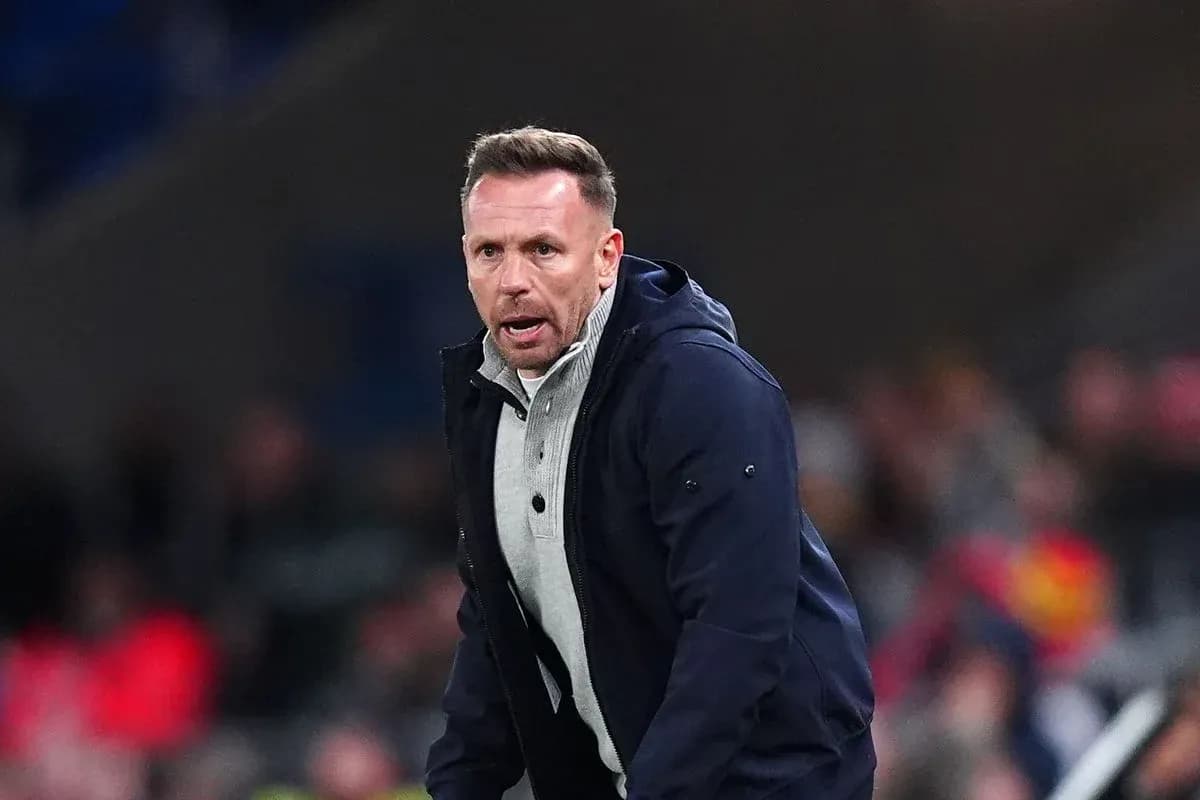 Manager coaching from the sidelines during match