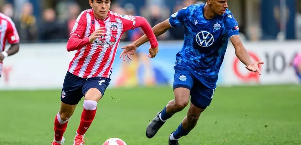 HFX Wanderers FC player dribbling against Atlético Ottawa