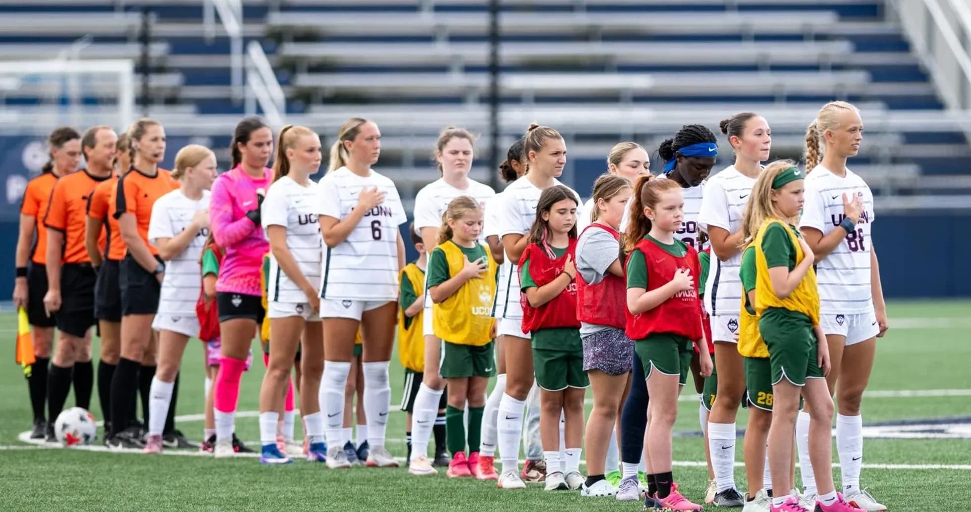 Players and referees lined up before soccer match