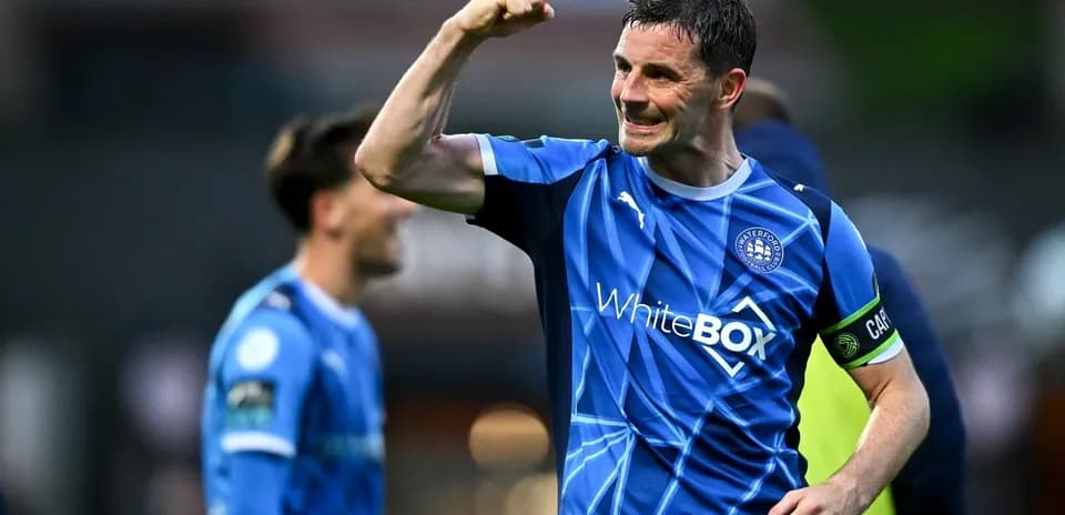 Player celebrating with a raised fist on field