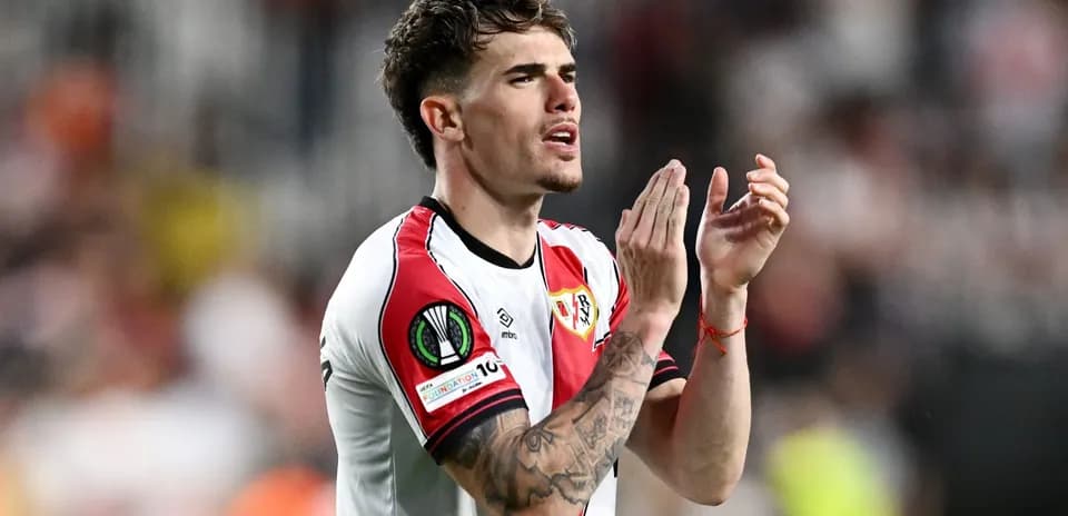 Player applauding fans during a match